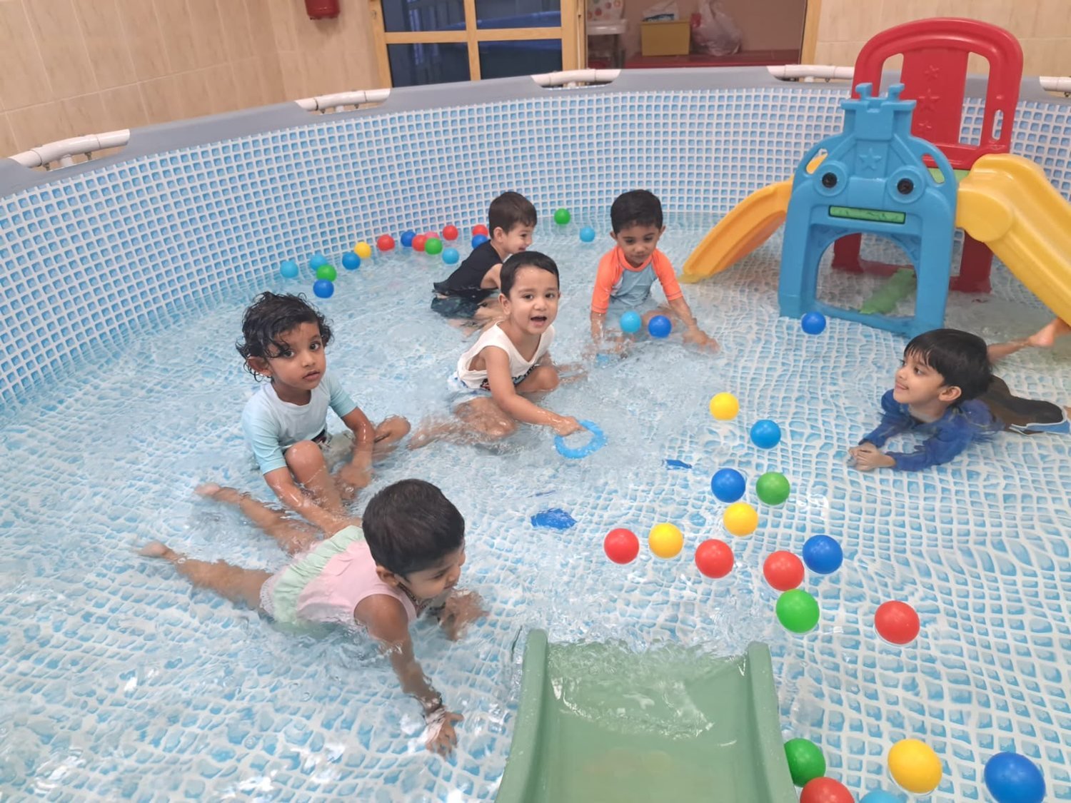 Children enjoying the kids' ball-pit pool