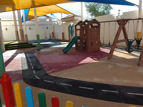 Snow White Nursery's shaded outdoor play area