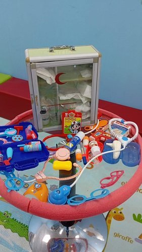 A play doctor's kit set up for imaginative play