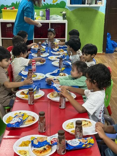 Children enjoying a meal together at the table